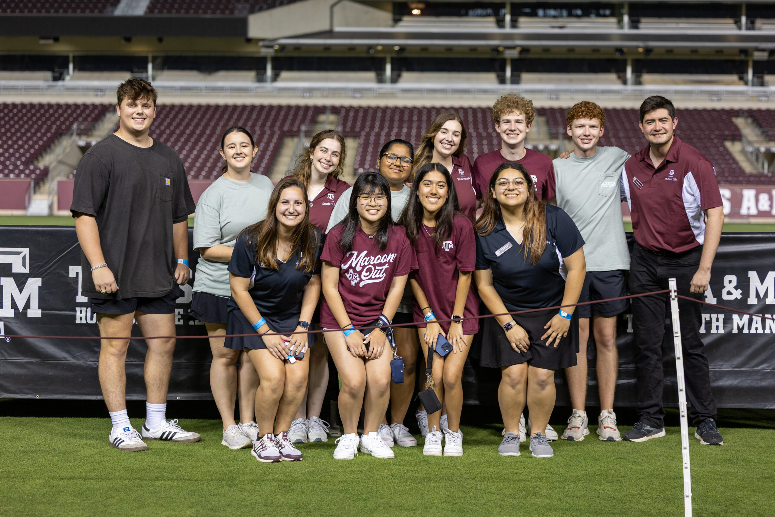 Smiling group of student leaders walking on campus